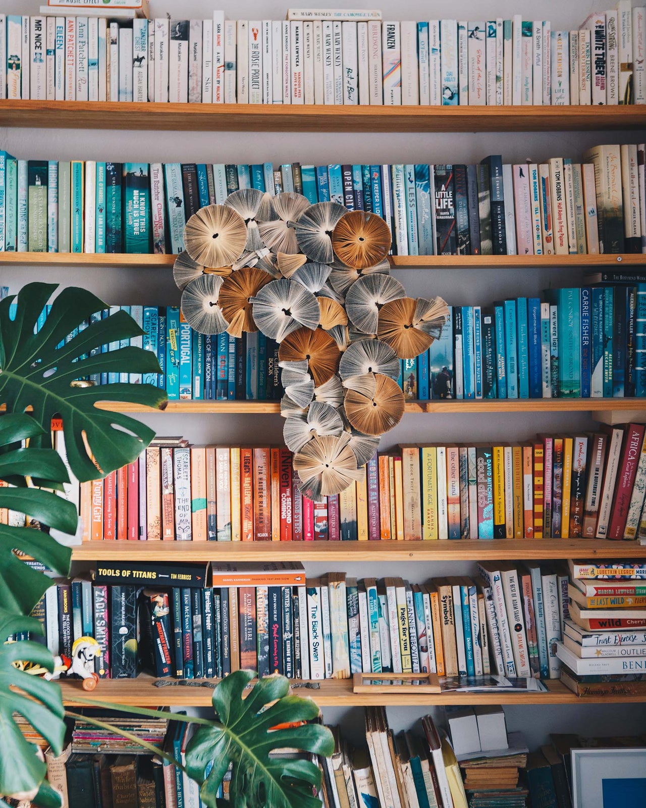 Artist - Keri Muller:  A sculpture in the shape of Africa made from recycled books
